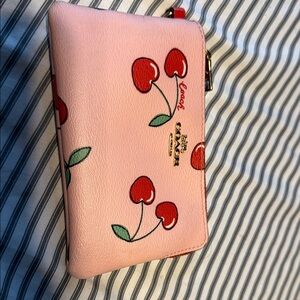 Coach Pink Wristlet with Cherry Design